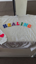 Load and play video in Gallery viewer, "Healing" Multicolor Patch Hoodie